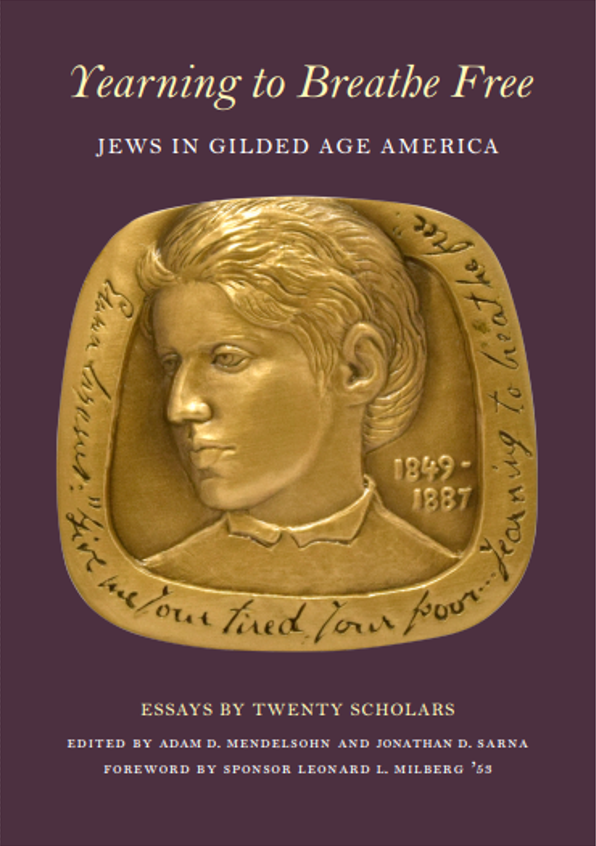 Purple book with a large golden medal featuring the face of Emma Lazarus